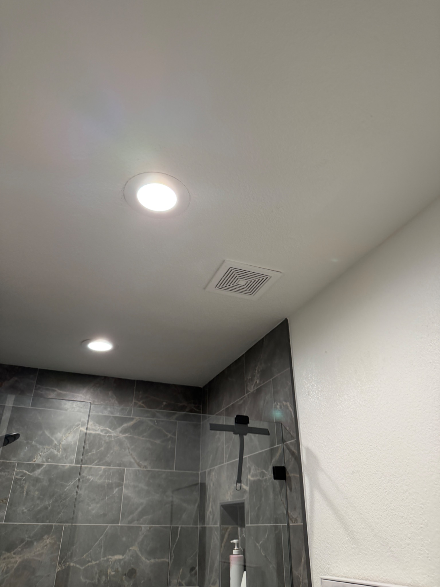 Quiet bathroom exhaust fan installed in a Spanish Springs home by Surge Electric